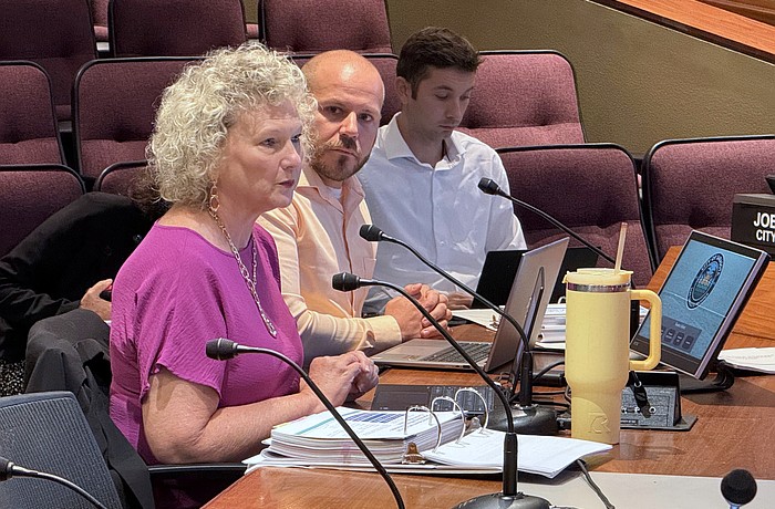 Sarasota Director of Finance Kelly Strickland talks fiscal year 2026 budget with the Sarasota City Commission as Budget Manager Tyler Harris looks on.
