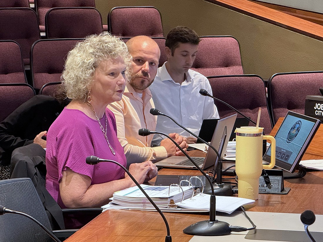 Sarasota Director of Finance Kelly Strickland talks fiscal year 2026 budget with the Sarasota City Commission as Budget Manager Tyler Harris looks on.