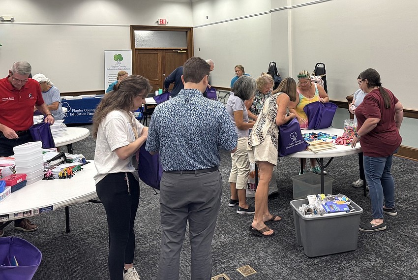 Volunteers pack 2,000 school supply kits for the Flagler County Education Foundation STUFF Bus program. Courtesy photo