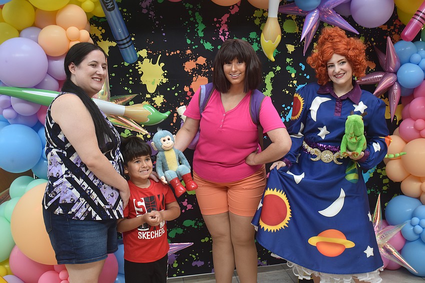 Sarasota resident Dana Crispin and her 4-year-old son Zayden are eager to pose with Dora from 
