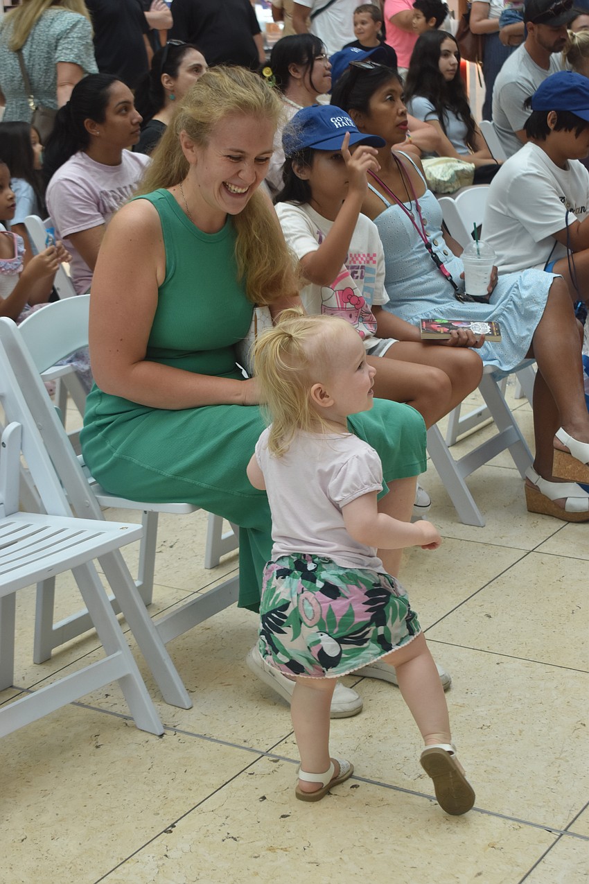 Sarasota residents Anna Lonseth and Reghan Lonseth, 1, listen to a lot of classical music at home, so it was no suprise that Reghan was on her feet while enjoying the ballet performances.