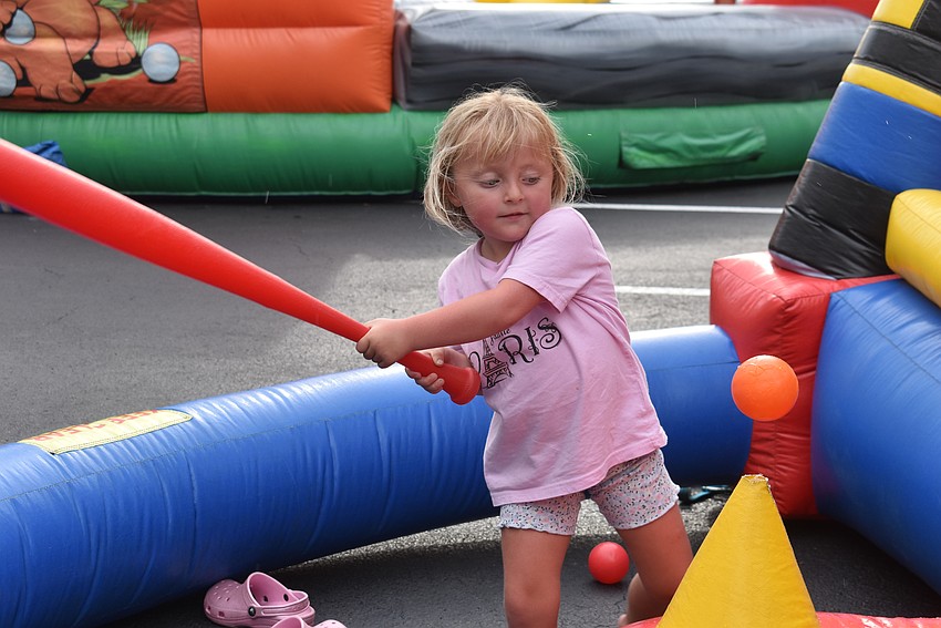Lakewood Ranch's Collette Harris, 4, keeps her eyes on the ball and takes her best shot.