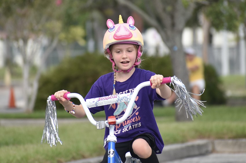 Sophie Windsor, 7, rides on the obstacle course.