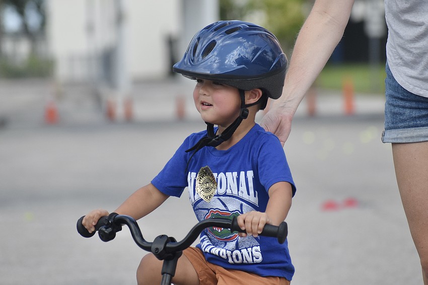 Leo Gomez, 3, rides with help from his mother Jill Bowen.