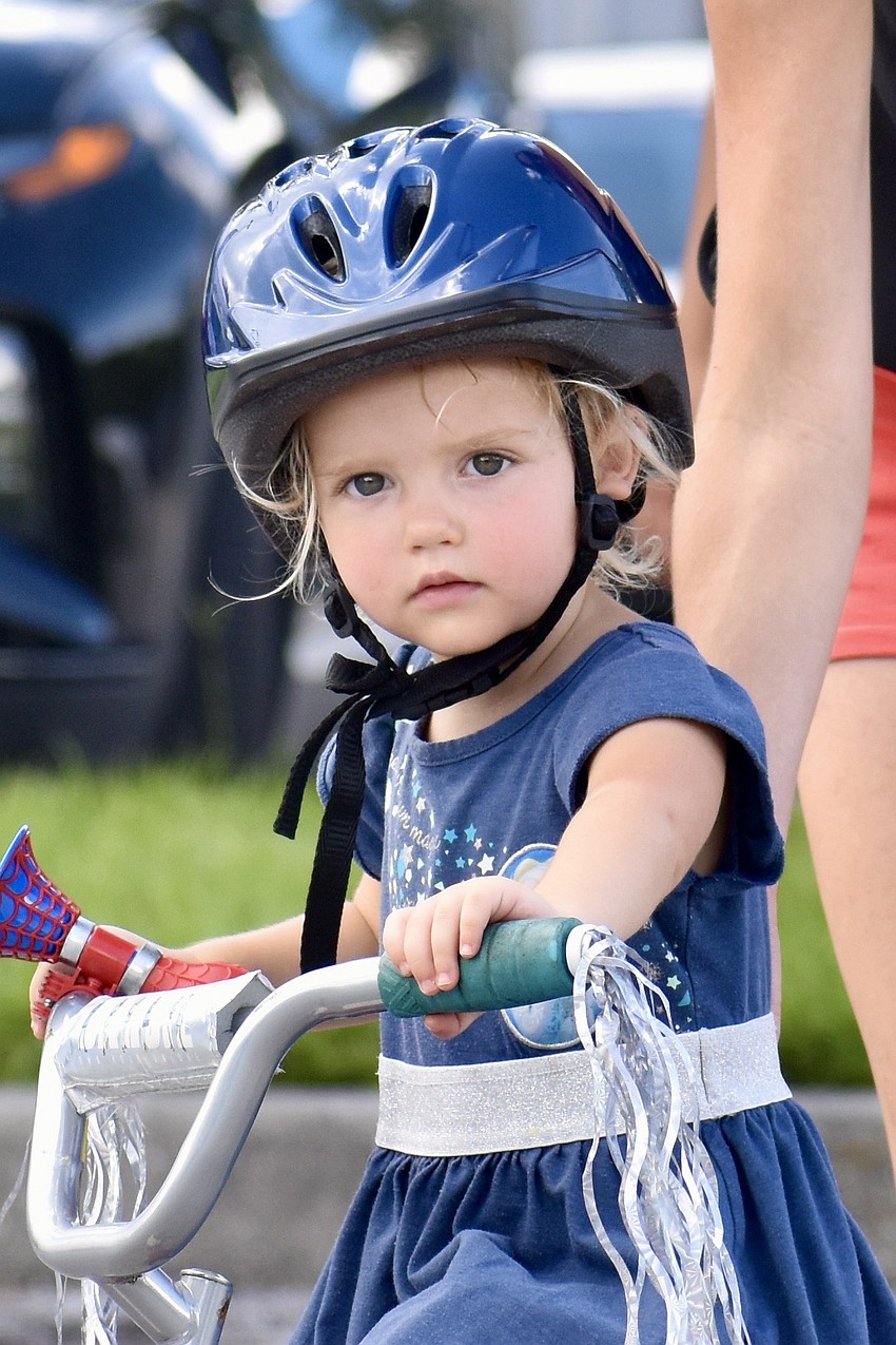 Ivy Windsor, 2, rides on the course.