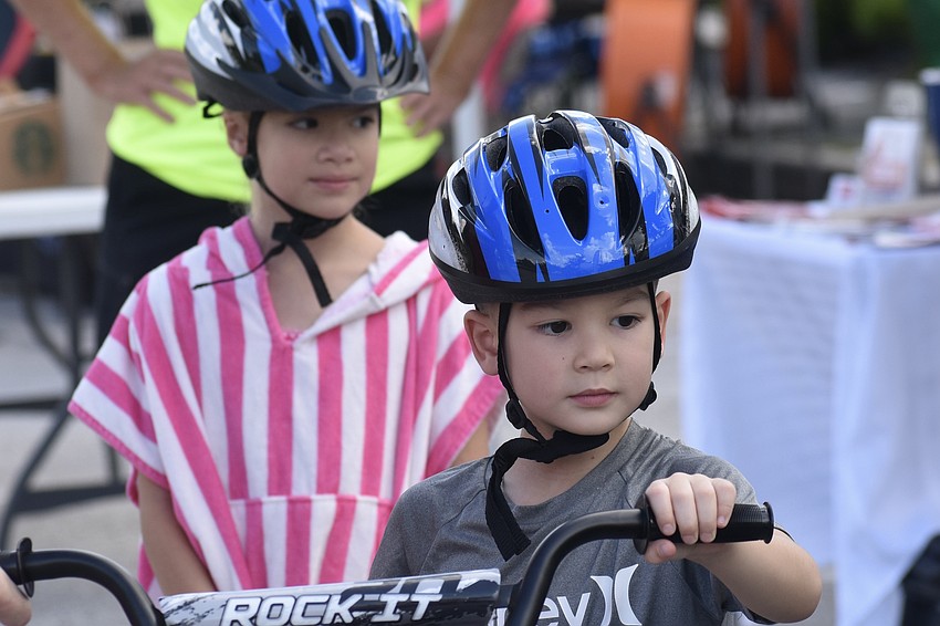 Marina Prybylski, 7, and her brother Tristan Prybylski, 5, prepare to head onto the course.