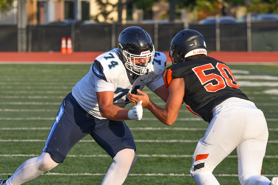 Dr. Phillips’ R.J. Stamm (No. 74) blocks the Winter Park defender during the Panthers' 2025 spring football game.