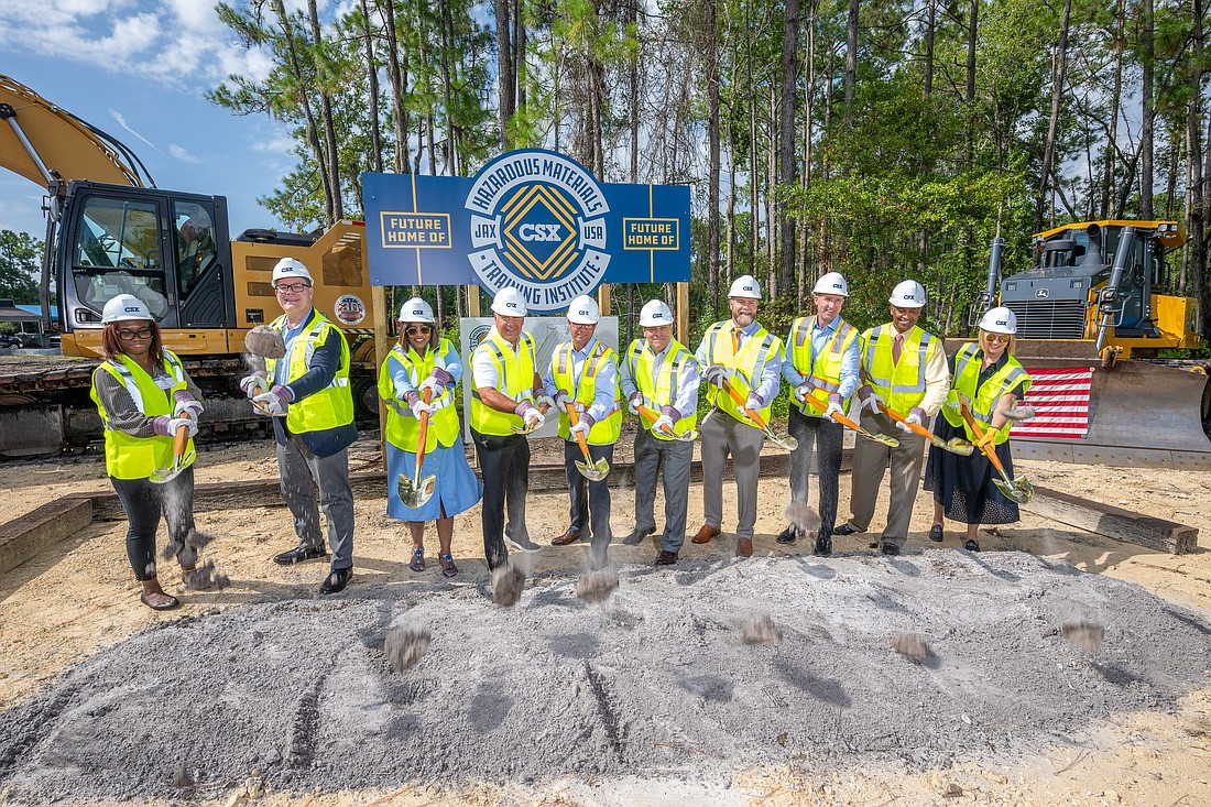 Officials from CSX Corp. and Florida State College at Jacksonville broke ground Aug. 4 to begin construction of the CSX Hazardous Materials Training Institute. From left: Gari Savage, legislative aide for State Sen. Tracie Davis; state Rep. Dean Black; state Rep. Kiyan Michael; Joe Hinrichs, CSX president and CEO; JFRD Lt. Jason Carpenter, JFRD assistant director of the Fire Academy of the South; John Avendano, FSCJ president and CEO; U.S. Rep. Aaron Bean; Michael Burns, CSX senior vice president and chief legal officer; Wayne Young, FSCJ board chair; and Diana Sorfleet, CSX executive vice president and chief administrative officer.