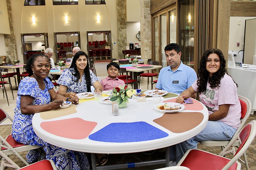 Patricia Jacinto joins Marcia, Abraham, Claudio and Jennyfer Evaristo at the fundraiser lunch at Christ Church of Longboat Key on Aug. 3.