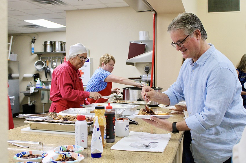 The Texas-inspired fundraiser buffet included pork, fried chicken, cornbread, chili and other fixings.