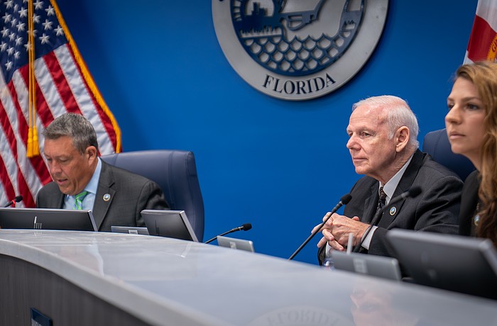 Commissioners George Kruse, Bob McCann and Amanda Ballard debate the merits of a curfew for residents under the age of 17 at the Aug. 5 commission meeting.