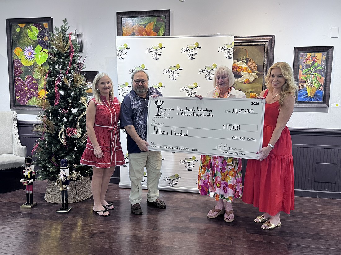 Jewish Federation Executive Director Rabbi Rob Lennick (second from left) and representatives from the Margarita Society of Volusia County. Courtesy photo