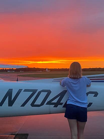 Jasmine Vitkauskas peers at the sunset during her eight-week Flight Academy at Indiana Wesleyan University. Courtesy photo