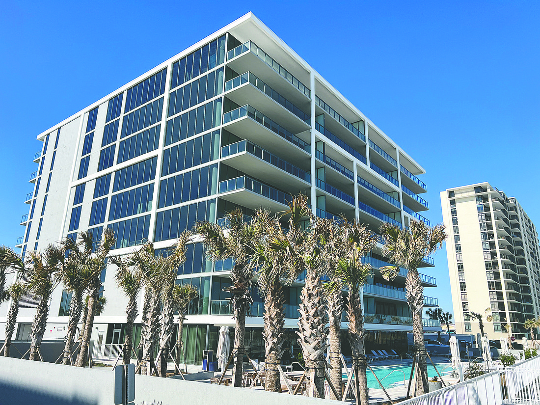 Oceanfront condo with amenities including a fitness center, outdoor bar, game room, pool and parking garage.