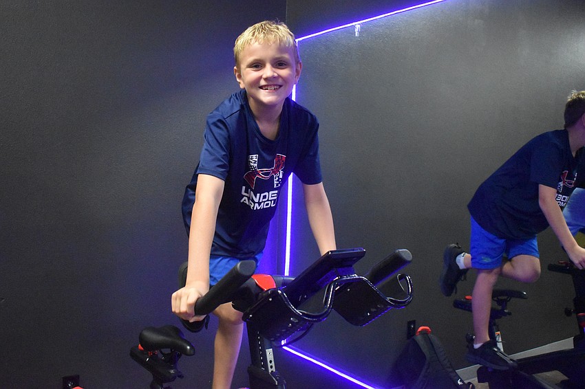 Lakewood Ranch camper Nyle Super, 8, trains for the upcoming triathlon at the Lakewood Ranch YMCA that will occur on Aug. 23. Super didn't know about the event when he started going to the camp, but is eager to participate.