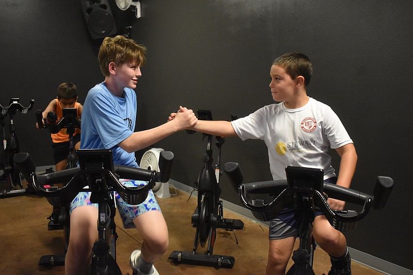 Lakewood Ranch's Brady Kerr and Blake McGrew both enjoy the biking part of a triathlon over swimming and running. McGrew describes it as exciting and fun, especially because he gets to do it with his friends.