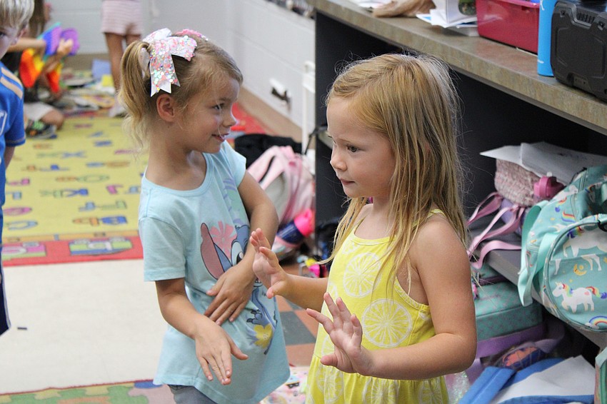 Lakewood Ranch's Zoey Evans and London Nooney, both 5 years old, freeze in place when 