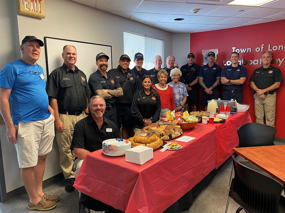 Longboat Island Chapel Chef Chef David Stone, Longboat Key Police Department Training Captain David Eggleston, Firefighter/Paramedic (FF/P) Ryan Corso, Lt. Jose Rivera, FF/P David Oliger, Assistant Chief Mike Regnier, Lt. Ron Koper, Lt. Tim Haas, FF/P Jamison Urch, FF/P William Lewis, Fire Chief Paul Dezzi; front row Rev. Brock Patterson Fire/Rescue Liaison CC Imbriaco, chapel members Carol Peschel and Connie DiMaggio. Members of Longboat Island Chapel provided a special lunch to firefighters at Station 92 on Longboat Key.
