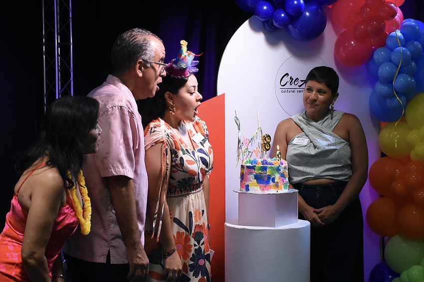 Board members Kilvian Tiburcio, Marc Masferrer, Co-founder and Producing Artistic Director Carolina Franco, and board member Amanda Rico hold the birthday ceremony.
