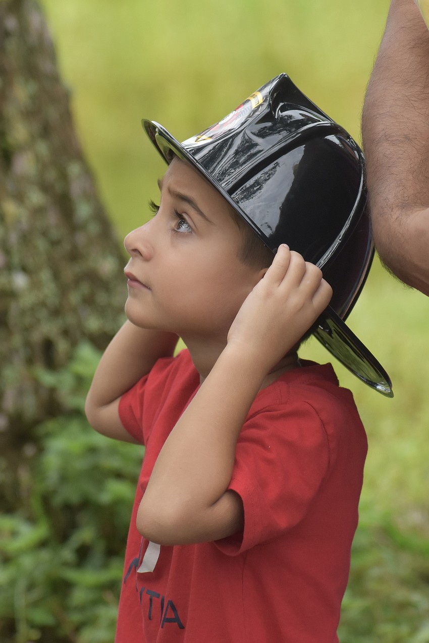 Ayaan Patel, 5, watches as the helicopter comes in for a landing.