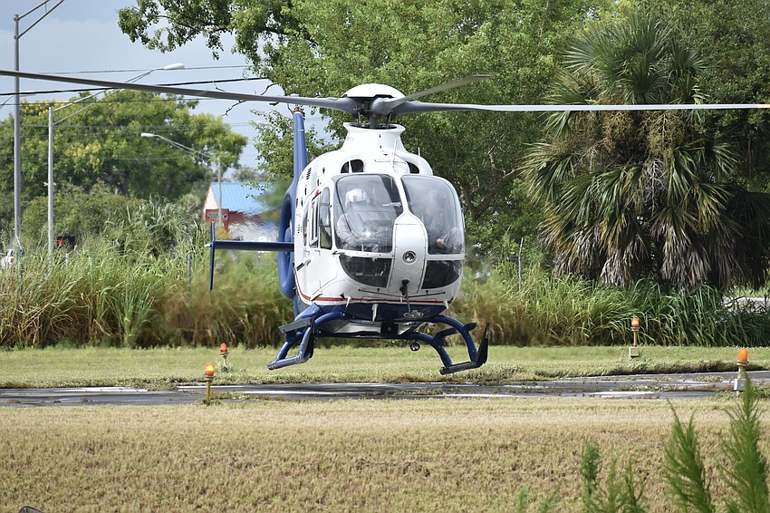 The helicopter touches down.