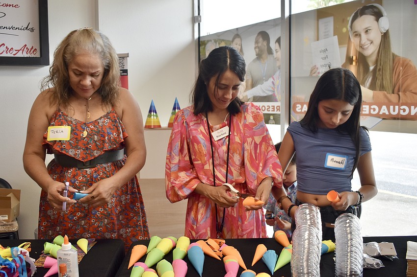 Volunteers Perla Marcano, Miriam Montiel Martinez and Martinez's niece, Miranda Montiel López, 11 provided crafts for kids.