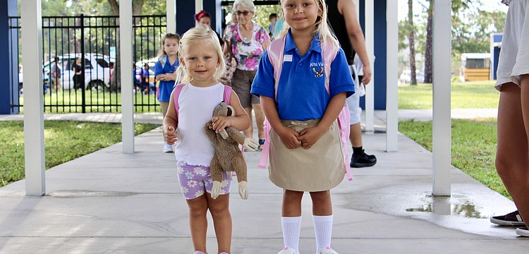 Martina Kandrachoff sees off her older sister, Guillermina, for her first day of school at Alta Vista Elementary School on Aug. 11.