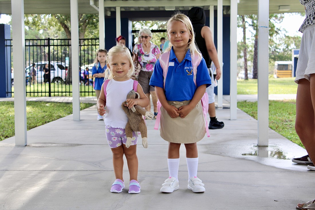 Martina Kandrachoff sees off her older sister, Guillermina, for her first day of school at Alta Vista Elementary School on Aug. 11.