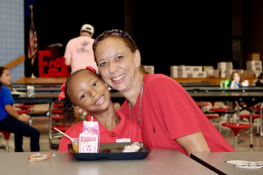 Amanda Swatek has breakfast with her daughter, Malia McCullough. Malia said she is most excited for physical education class on her first day of kindergarten.