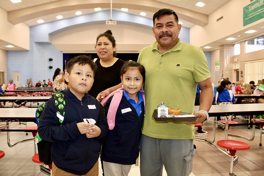 Pedro and Faviola Mendez enjoy breakfast with their children, Isla and Silas, on the first day of school at Alta Vista Elementary School on Monday.