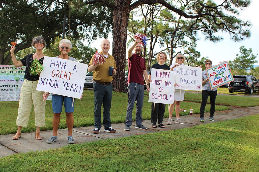 Members of the neighboring First Congregational United Church of Christ cheer on students heading into their first day of school at Alta Vista Elementary School. From left, Toska Strong, Pauline Geary, Jason Branham, Rev. Wes Bixby, Terri Crawford, Bernie Gottschalk and Nancy Taylor.