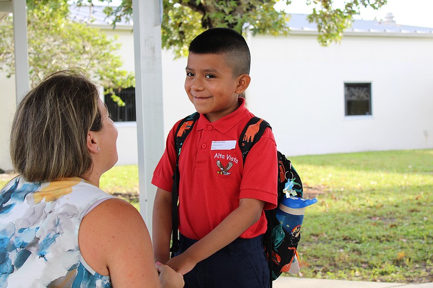 Erick Juarez-Lopez gets some words of encouragement as he starts his first day of first grade at Alta Vista Elementary School.