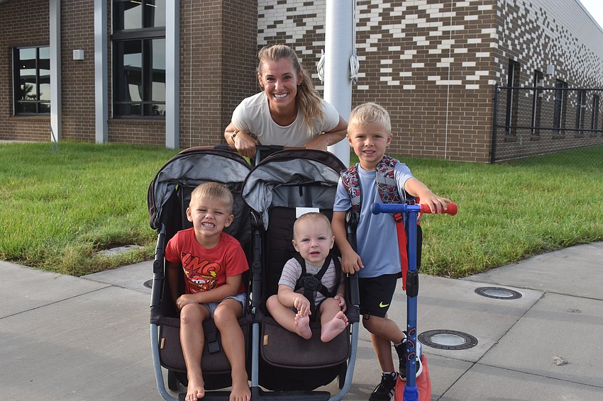 Valorie Baron brings sons Brady and Cam along for the ride to drop off Lake Manatee kindergarten student Jacob Baron. Jacob is looking forward to art class and likes making starfish out of clay.