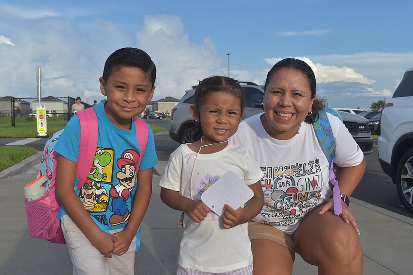 Third grade student Alex Montano, pre-K student Samantha Montano and their mom Connie De Leon are eager to grow along with the school. De Leon says Alex has always been independent and she was holding back tears in order to not upset Samantha on her very first day.