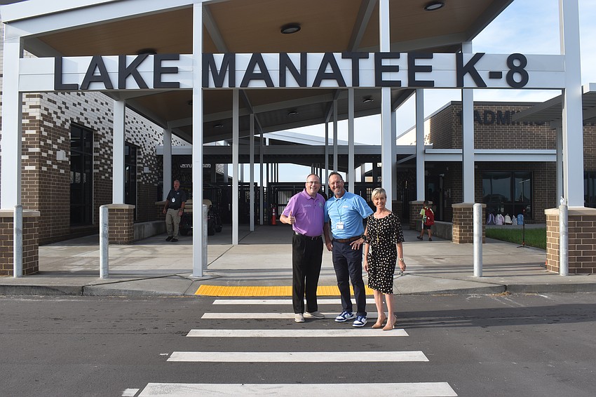 Interim superintendent Kevin Chapman, principal of Lake Manatee Todd Richardson and Annette Codelia, executive director of elementary schools at the School District of Manatee County, welcome students to their first day at Lake Manatee.