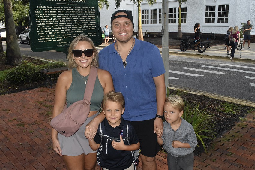 Erica Lavrentyev, her son Niko Lavrentyev, a first grader, her husband Kirill Lavrentyev, and her son Enzo Lavrentyev, a VPK student outside of Southside.