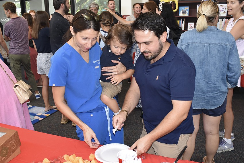 Nadia Polimeni, her one-year-old son Luca Polimeni, and her husband Dan Polimeni, enjoy the breakfast. Their son Leo is attending kindergarten at Southside.