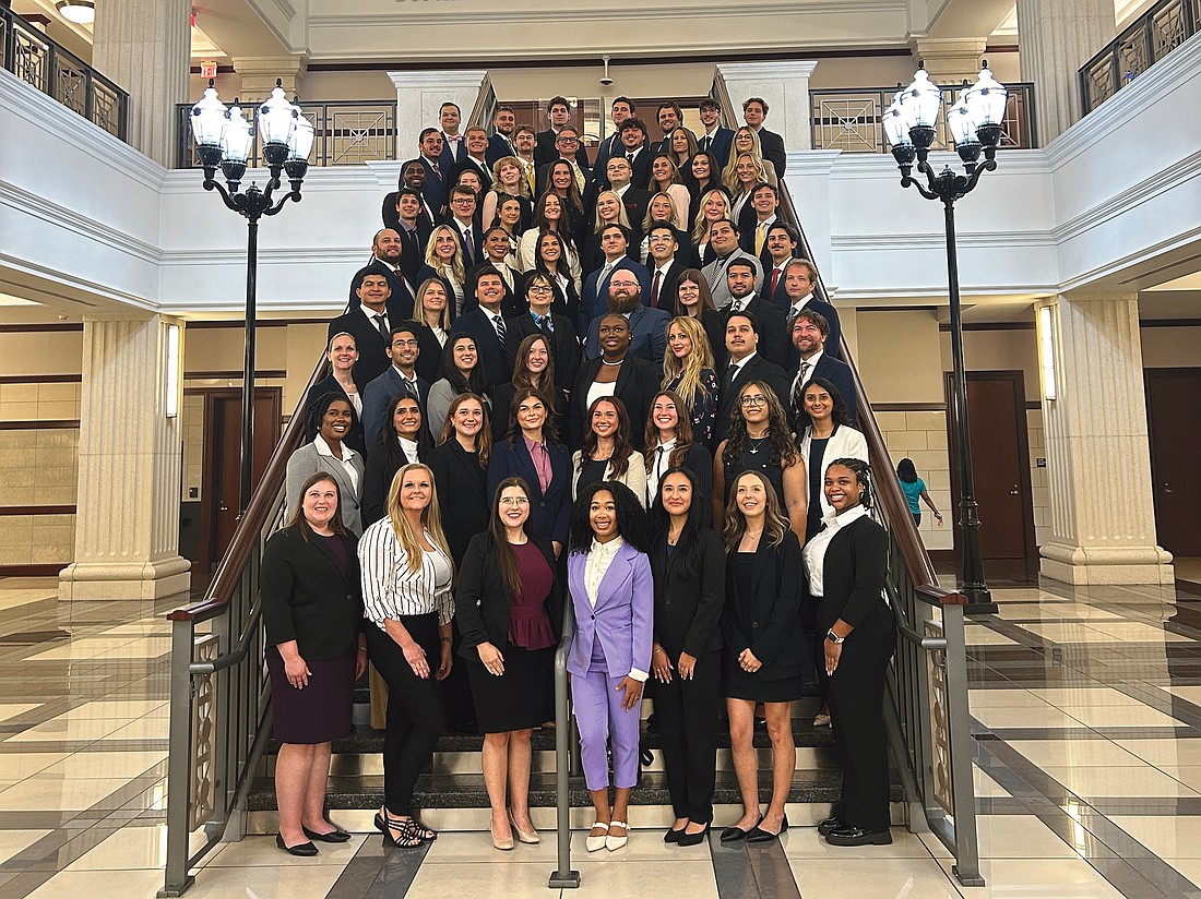 After their convocation ceremony Aug. 9, the Jacksonville University College of Law Class of 2028 posed for a group portrait on the staircase in the atrium at the Duval County Courthouse. Classes began Aug. 11.