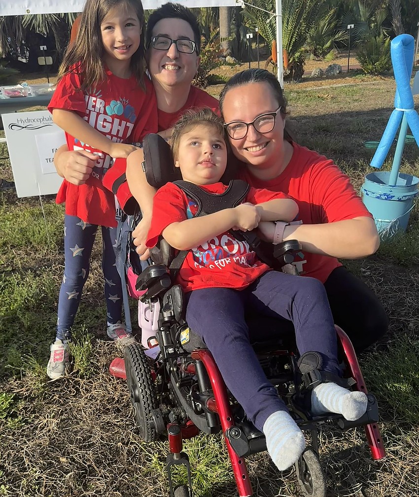 The Memolo family walks every year to raise money for hydrocephalus research. Its slogan is “No More BS,” meaning no more brain surgery.