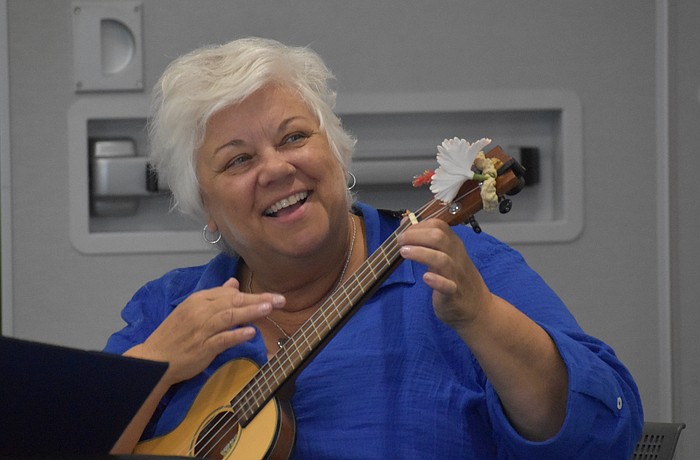 Aloha Ukulele president Alice Baumann leads Aloha Ukulele in song, mostly with ukulele but occasionally with other instruments. She says she has "five minutes more experience" than the members she leads.