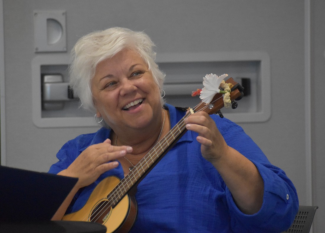 Aloha Ukulele president Alice Baumann leads Aloha Ukulele in song, mostly with ukulele but occasionally with other instruments. She says she has "five minutes more experience" than the members she leads.