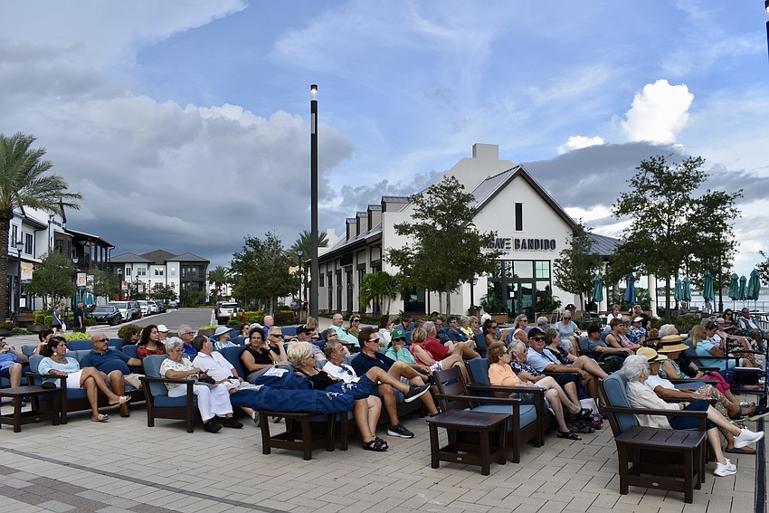 Over 50 people gather in front of the pavilion at Waterside Place to listen to the Suncoast Swing Band Aug. 13.