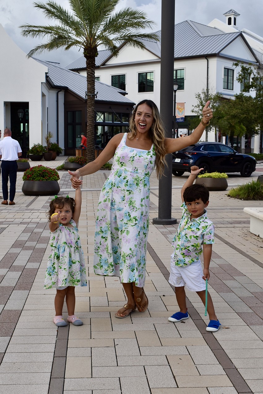 Waterside Place's Laura Thomaidis dances with her 2-year-old daughter Isabella and 3-year-old son Levi.