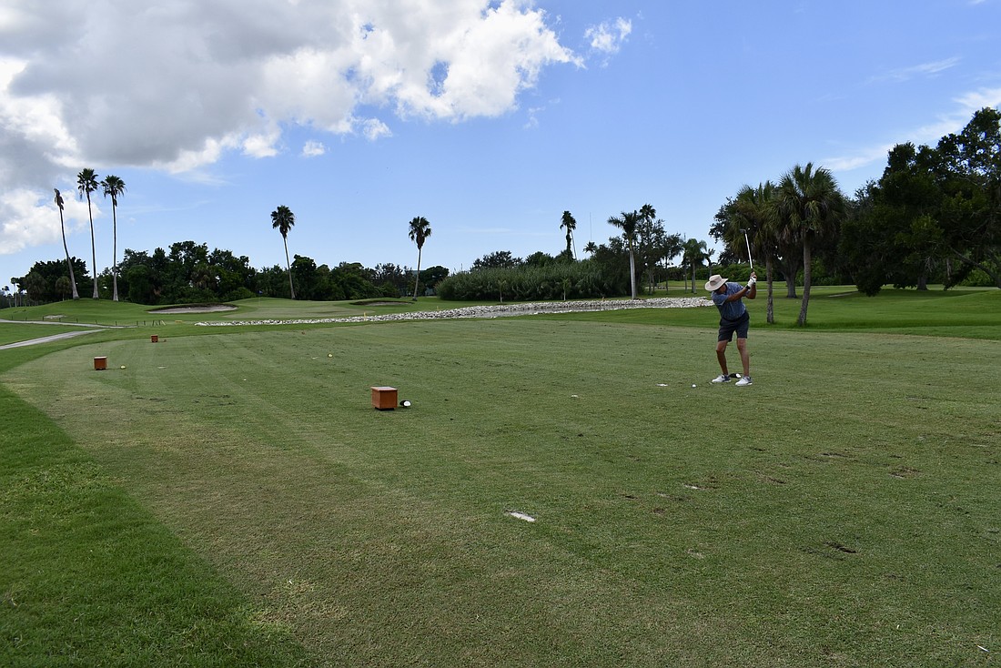 Bradenton's Steve Doll takes his best shot on Hole 17 at River Run Golf Links, one of the few affordable golf opportunities in Manatee County.