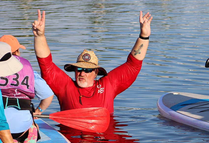 Pinellas County's Tim Scholz works the event as a starter, giving pep talks to the athletes and counting them off to begin.