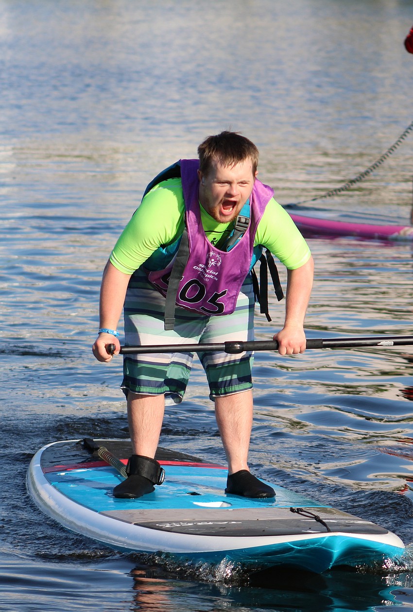 Duval County's Josiah Middleton lets out an excited yell as he completes his race at the Special Olympics Florida 2025 State Stand Up Paddle Competition on Aug. 16.