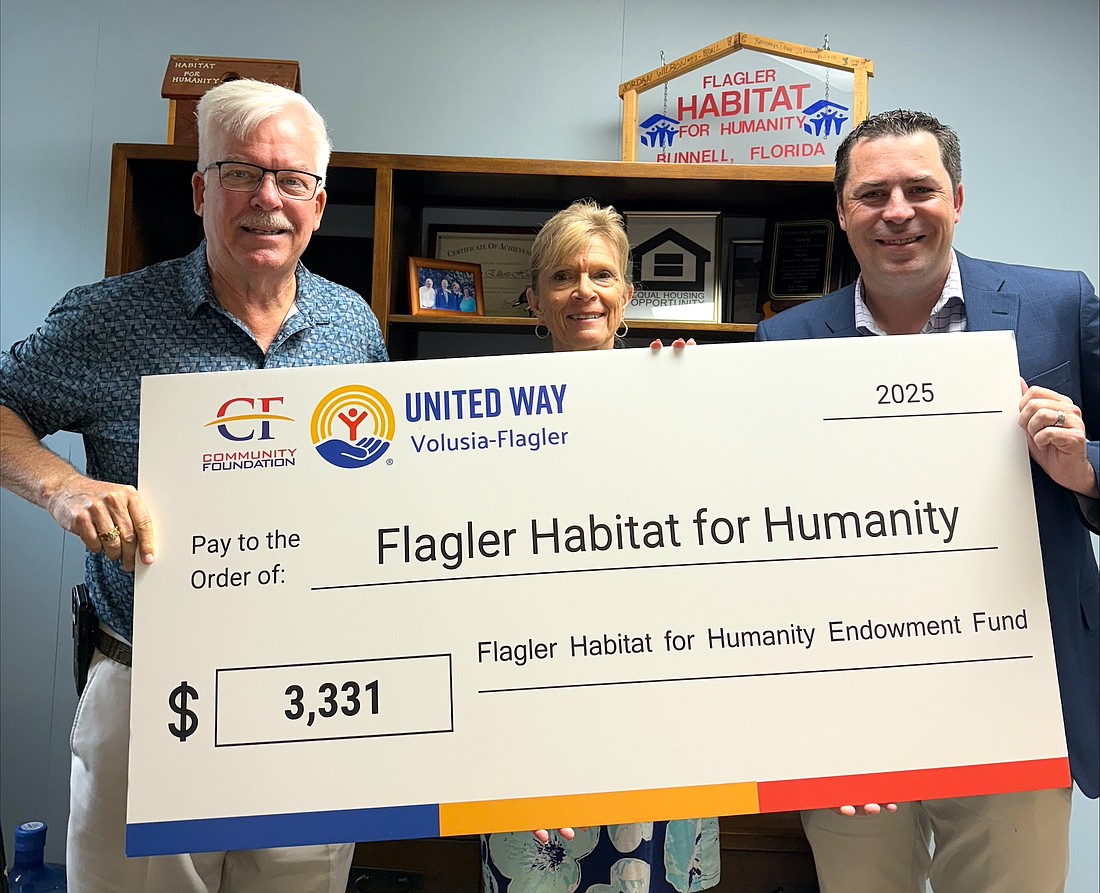 Flagler Habitat for Humanity Board of Directors President Bill Verhagen, Exectuive Director Maureen Crompton and Community Foundation of Volusia and Flagler Counties' Jason Stewart. Courtesy photo