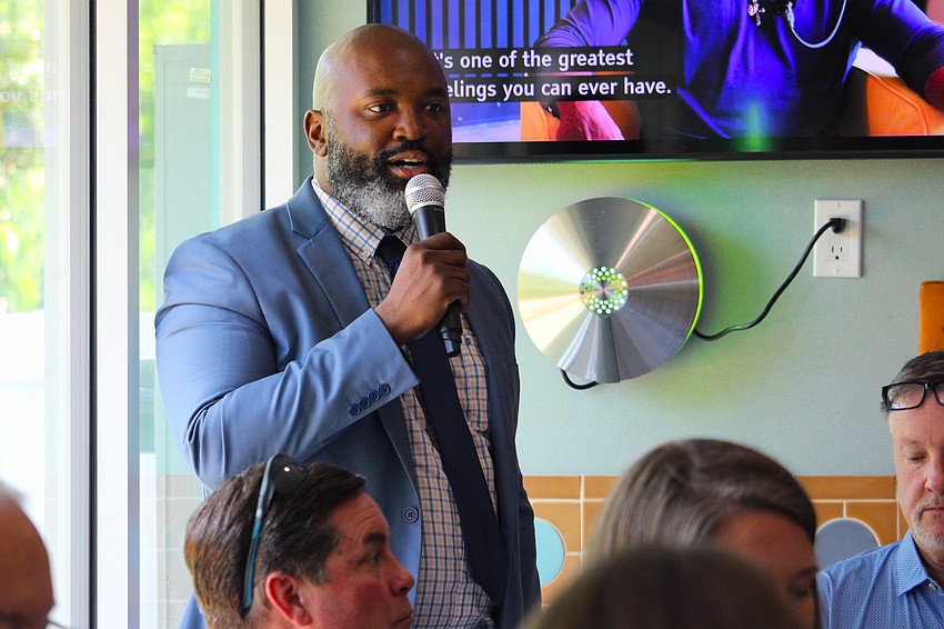 David Baptiste, branch manager at Ameris Bank, speaks with Longboat Key Chamber of Commerce members on Aug. 15 at Lo' Key Island Grille.
