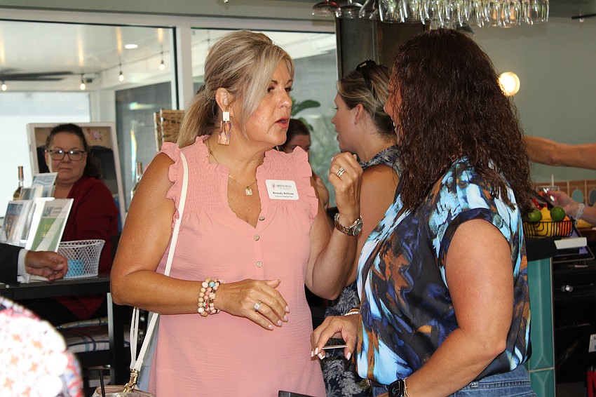 Brandy Britton, director of marketing development from Bringman Roofing, networks at the Longboat Key Chamber of Commerce's event on Aug. 15.