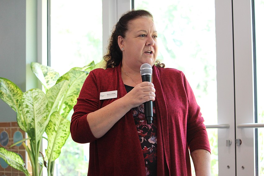 Owner Celia Moore updates attendees of the latest 